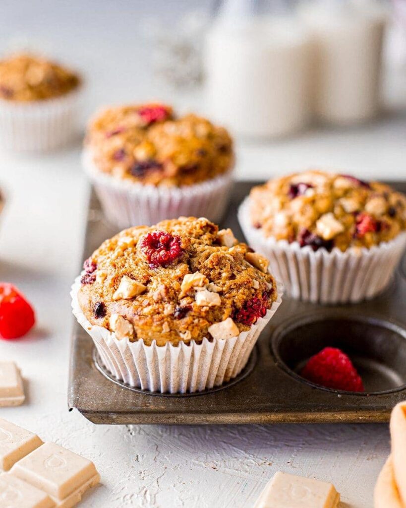 close up of vegan banana bread muffins with raspberry and white chocolate